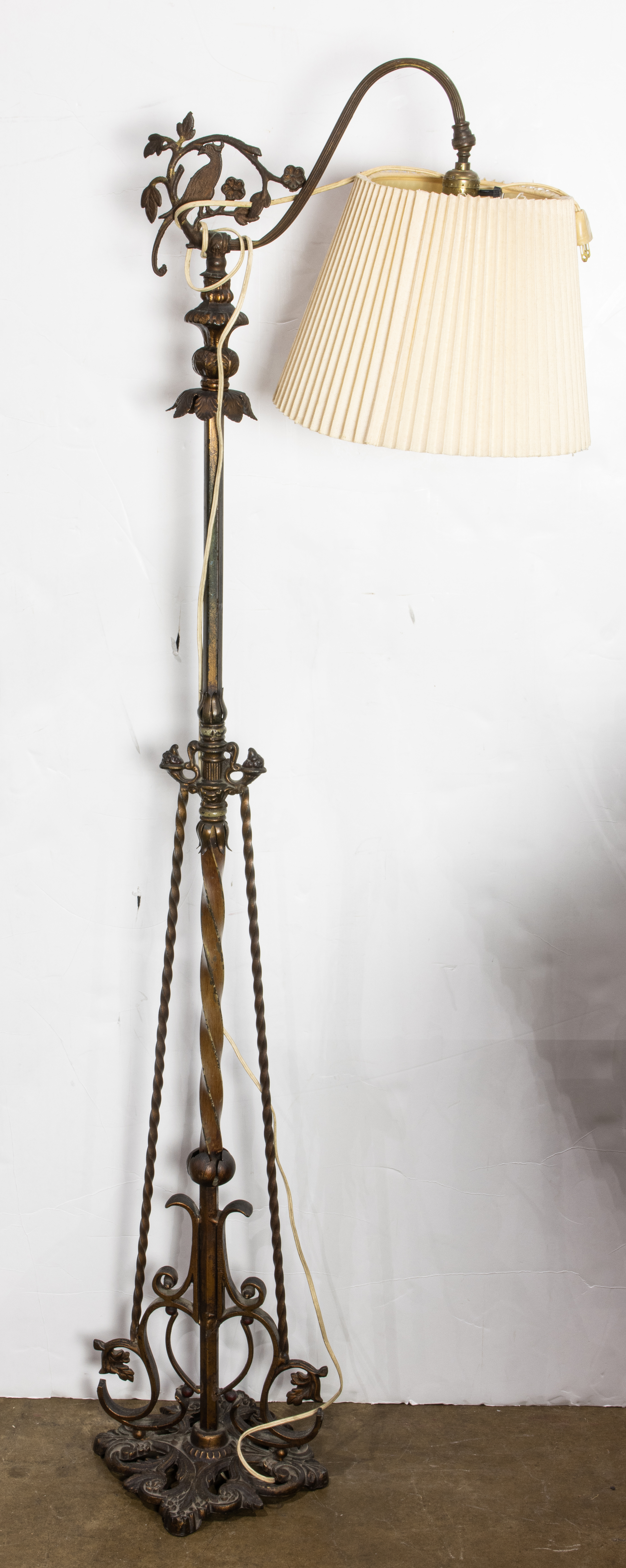 AN ARTS AND CRAFTS GILT TOLE AND