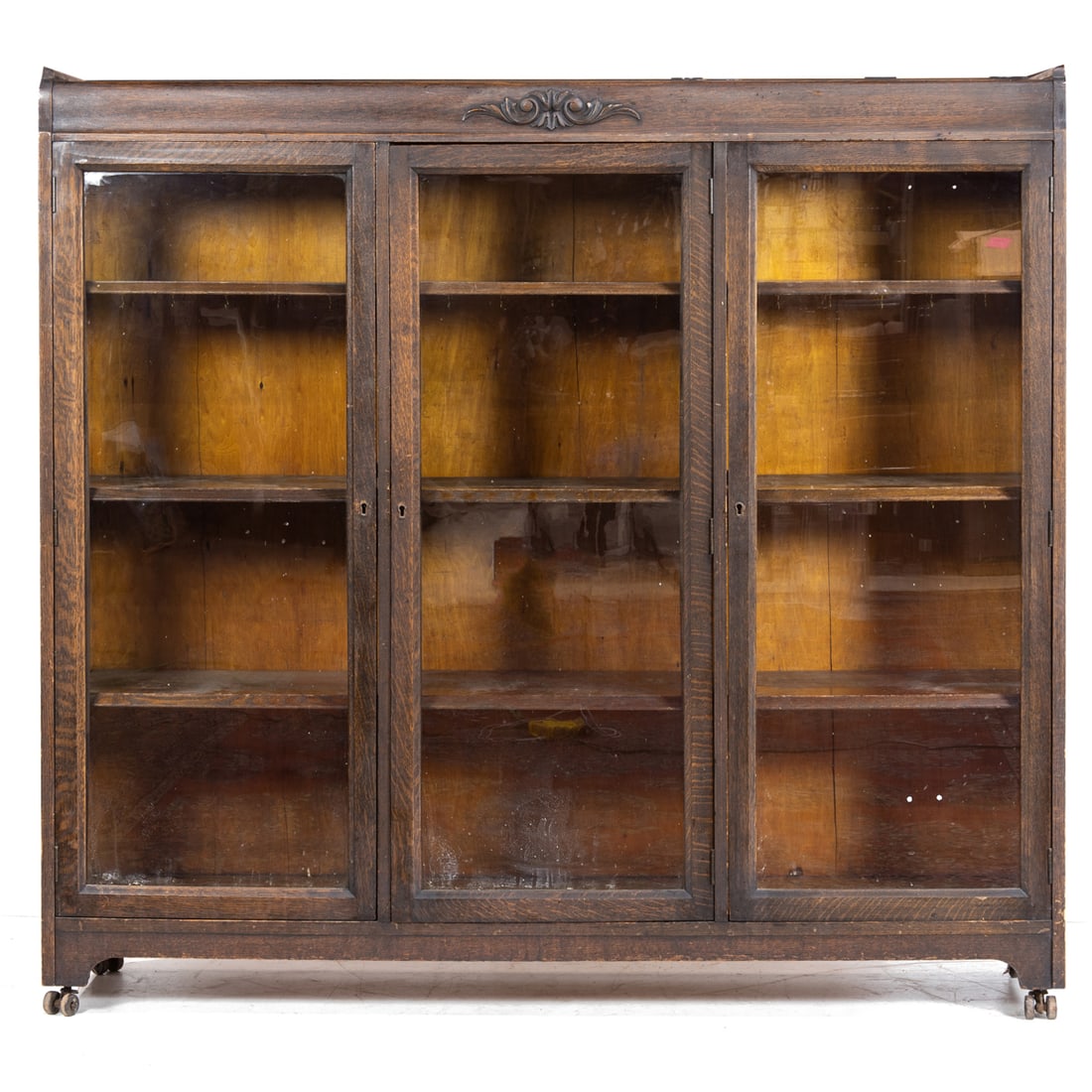 AN ARTS AND CRAFTS OAK BOOKCASEAn
