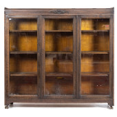 AN ARTS AND CRAFTS OAK BOOKCAS