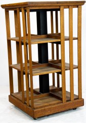 AN ARTS AND CRAFTS OAK REVOLVI
