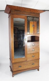An Arts & Crafts oak wardrobe