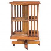 AN ARTS & CRAFTS OAK REVOLVING