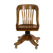 AN ARTS & CRAFTS OAK SWIVEL DE