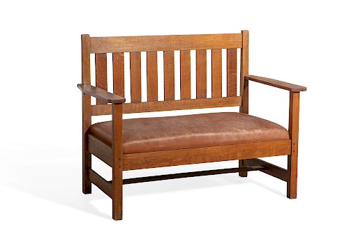 AN ARTS & CRAFTS OAK SETTEE