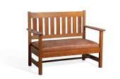 AN ARTS & CRAFTS OAK SETTEE BA