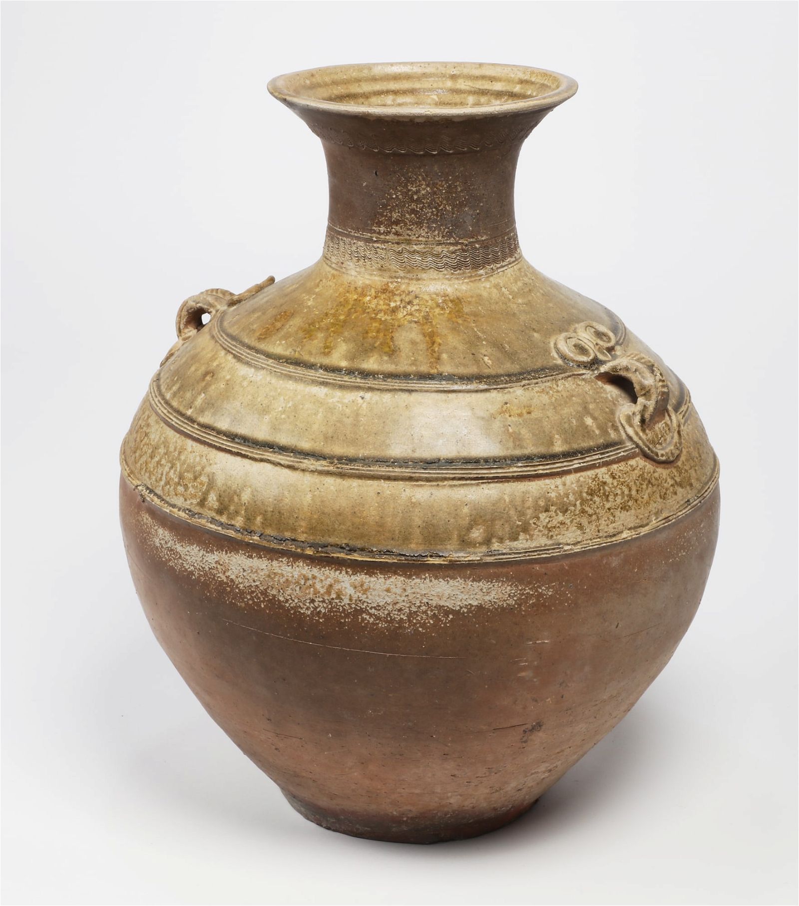 AN ASIAN GLAZED EARTHENWARE