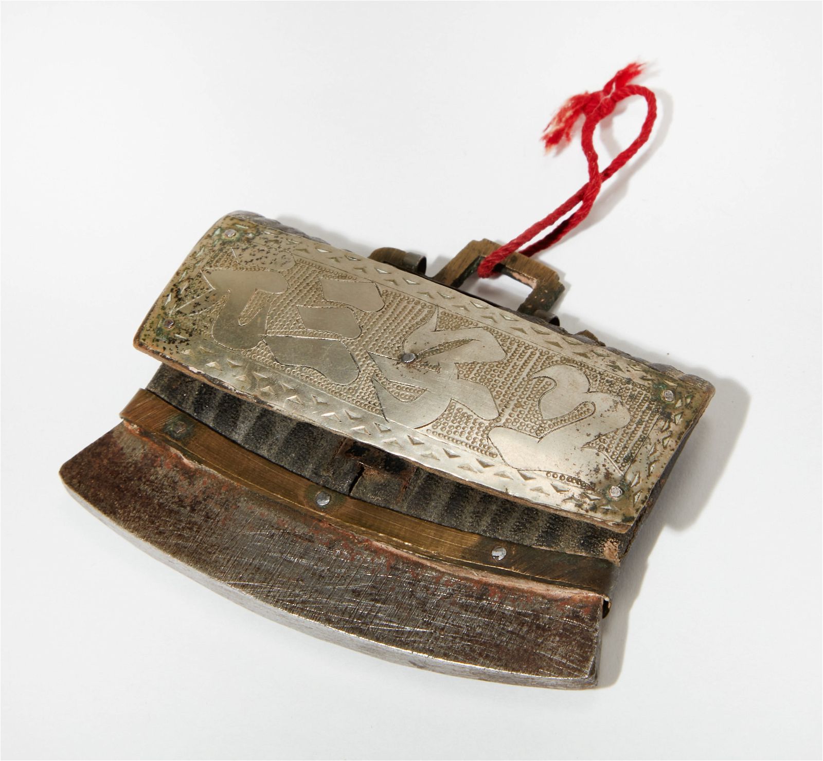 AN ASIAN WHITE METAL AND LEATHER