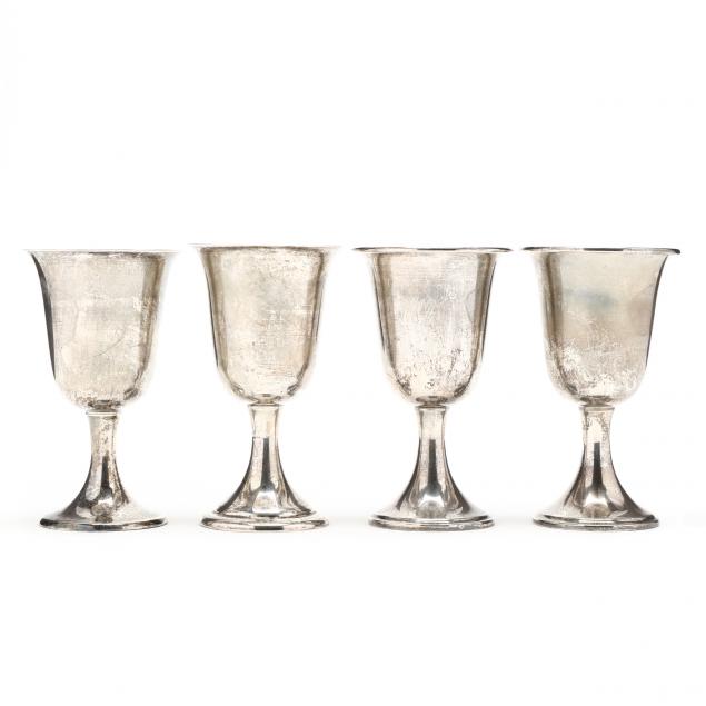AN ASSEMBLED SET OF FOUR STERLING