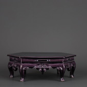 AN AUBERGINE-GLAZED CARVED 'FL