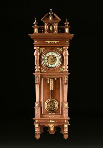 AN AUSTRIAN CARVED WALNUT THREE