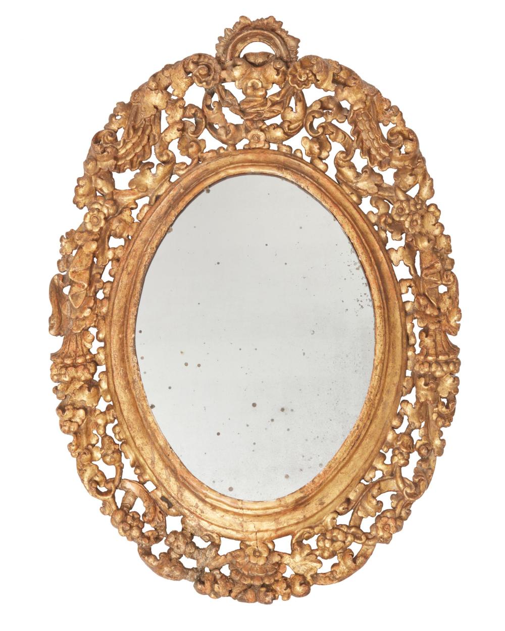 AN CARVED GILTWOOD WALL MIRRORAn
