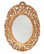 AN CARVED GILTWOOD WALL MIRROR