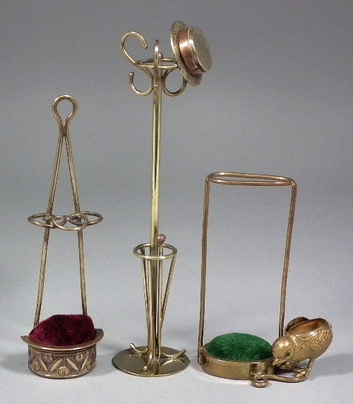 An early 20th Century brass hat pin