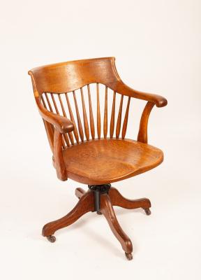 An early 20th Century oak swivel