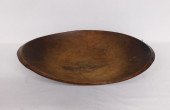 AN EARLY CARVED WOODEN TRENCHE