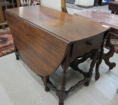 AN EARLY DROP-LEAF WALNUT DINI