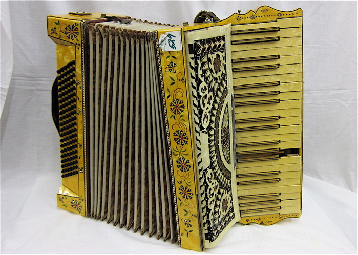 AN EARLY MODEL ACCORDION WITH