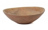AN EARLY RED PAINTED TREENWARE