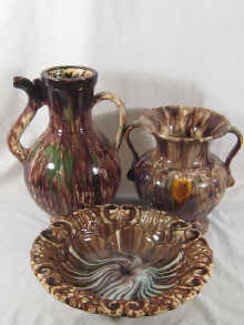 An earthenware bowl on three