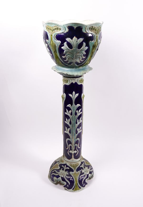 AN EARTHENWARE JARDINIERE AND