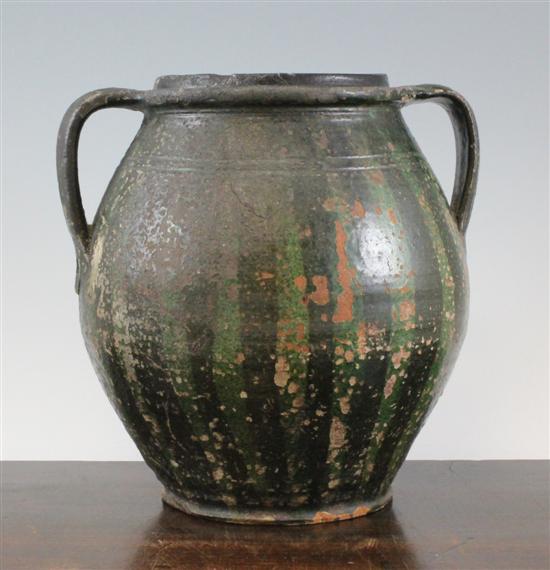 An earthenware twin handled spouted