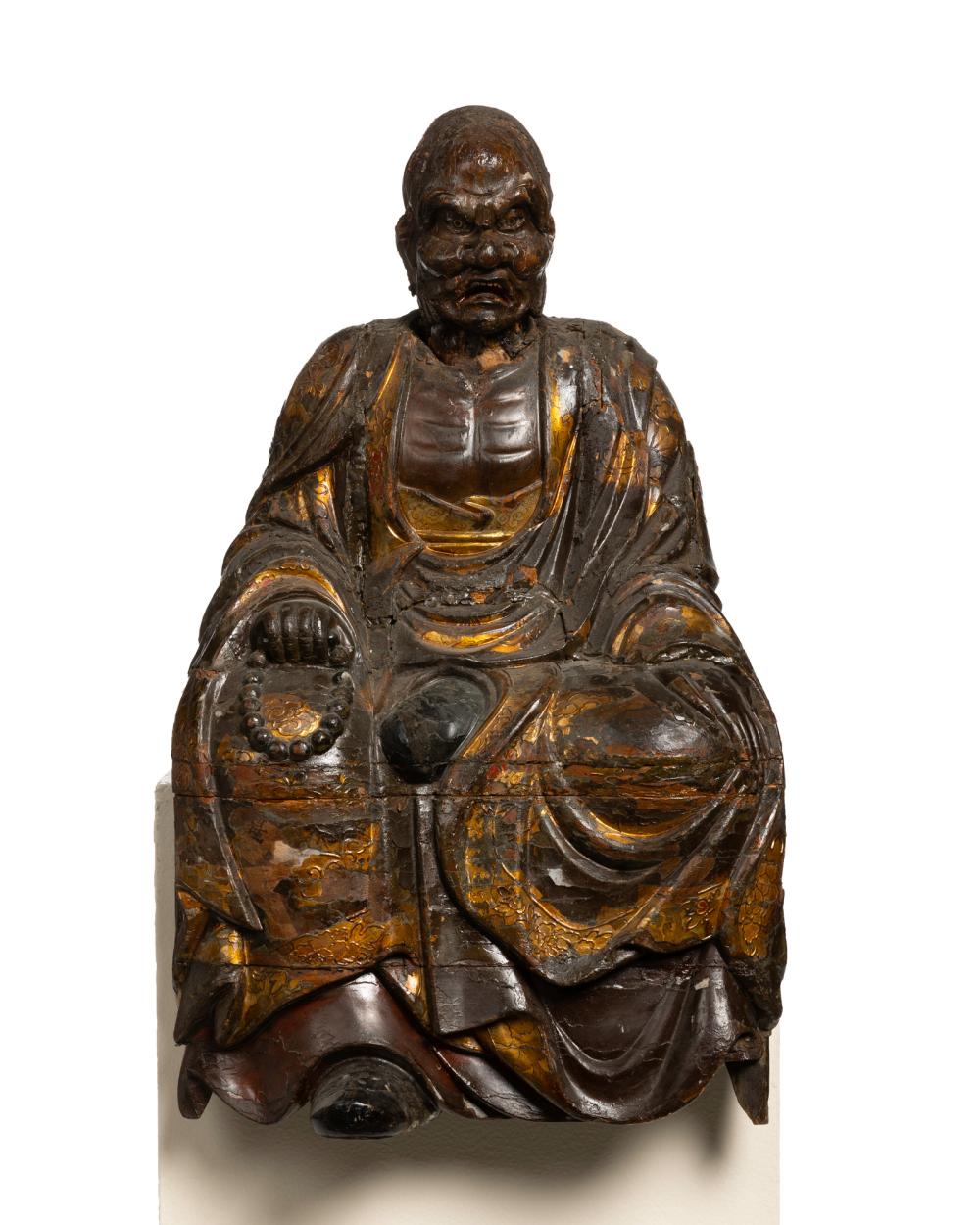 AN EAST ASIAN CARVED WOOD
