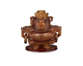 AN EAST ASIAN-STYLE CARVED QUA