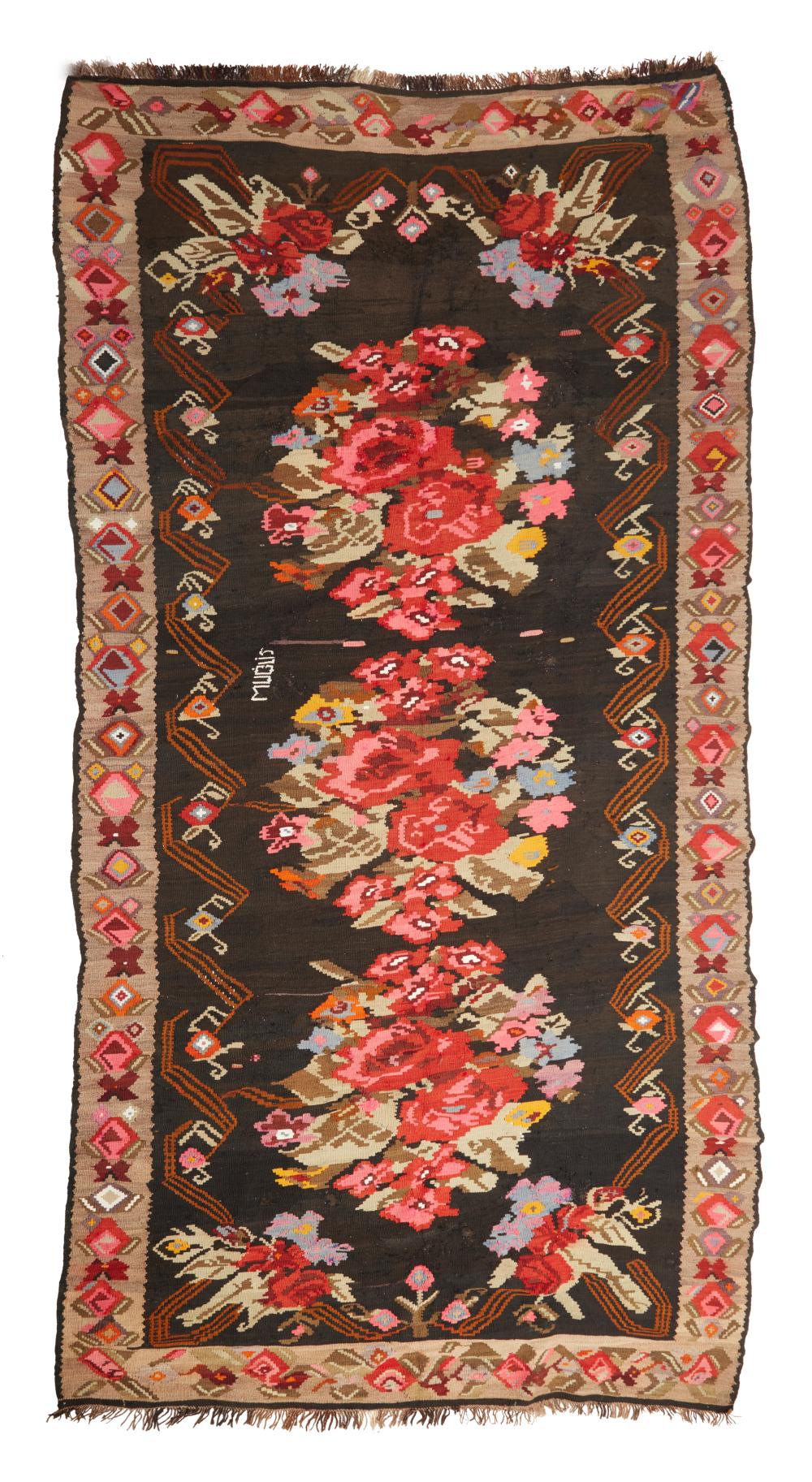 AN EASTERN EUROPEAN FLATWEAVE RUGAn