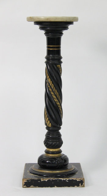 An ebonised and gilt painted