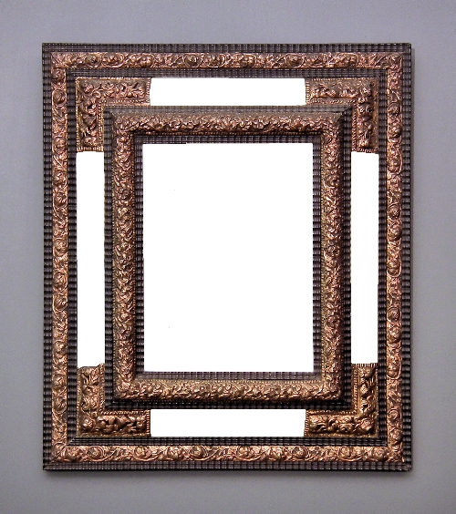 An ebonised and repousse gilt metal