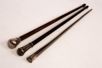 An ebonised walking stick with