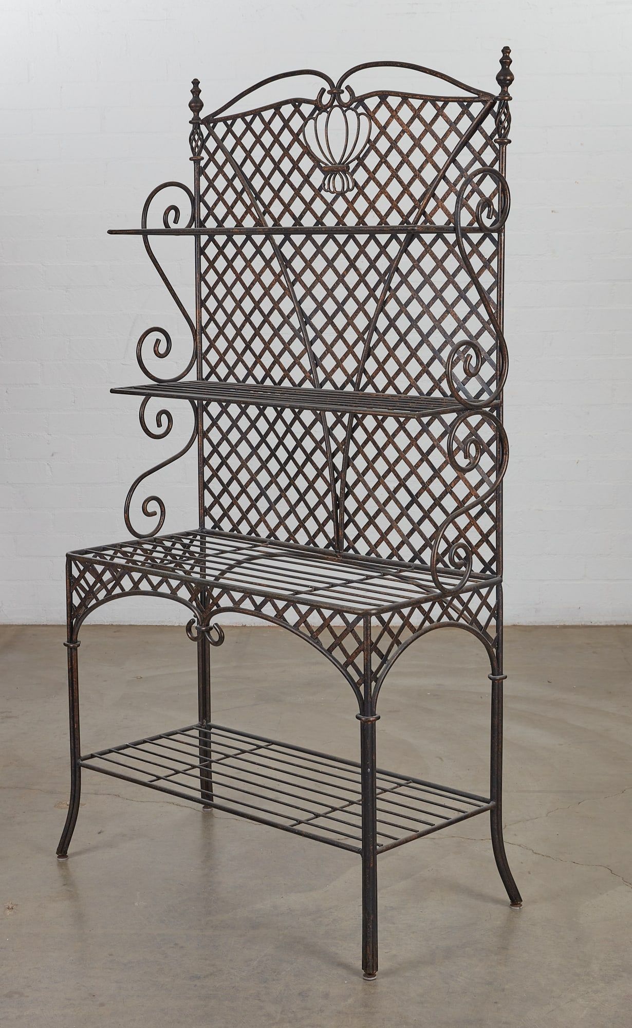 AN EBONIZED METAL BAKER'S RACK,