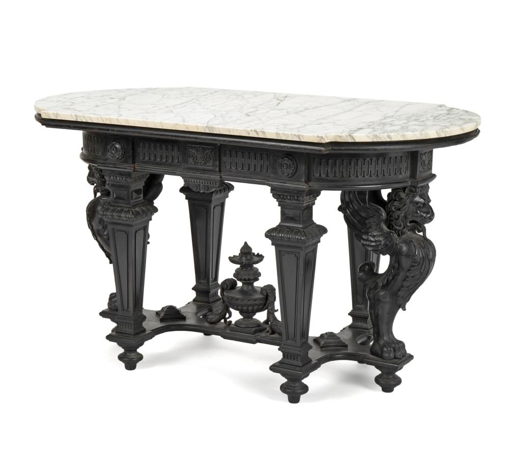 AN EBONIZED WOOD LIBRARY TABLEAn
