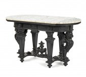 AN EBONIZED WOOD LIBRARY TABLE