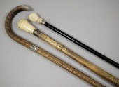 An ebony cane with ivory cane