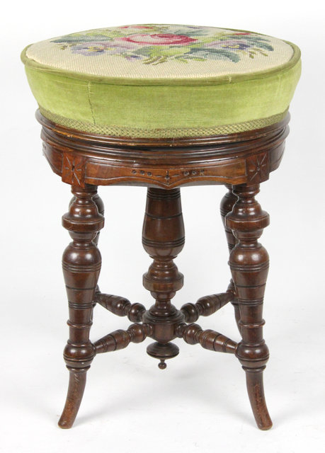 An Edwardian adjustable piano stool