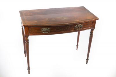 An Edwardian bowfront side table