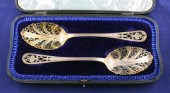 An Edwardian cased pair of fan