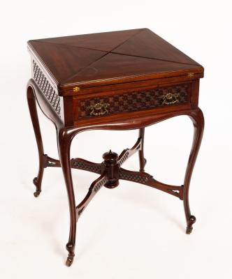 An Edwardian envelope card table on