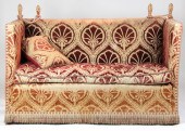 An Edwardian Knole sofa uphols