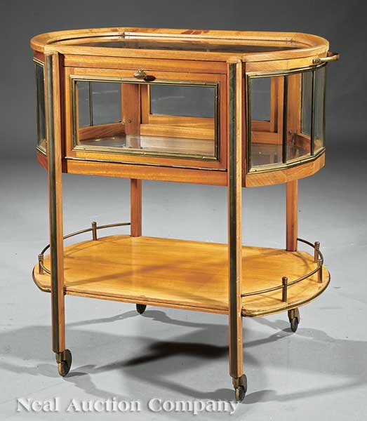 An Edwardian Mahogany and Brass Tea