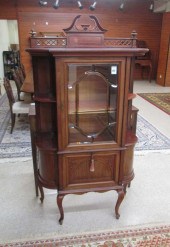 AN EDWARDIAN MAHOGANY CHINA CA