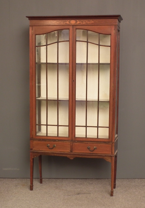 An Edwardian mahogany display