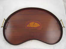An Edwardian mahogany kidney shaped