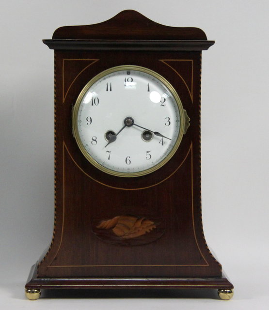 An Edwardian mahogany mantel