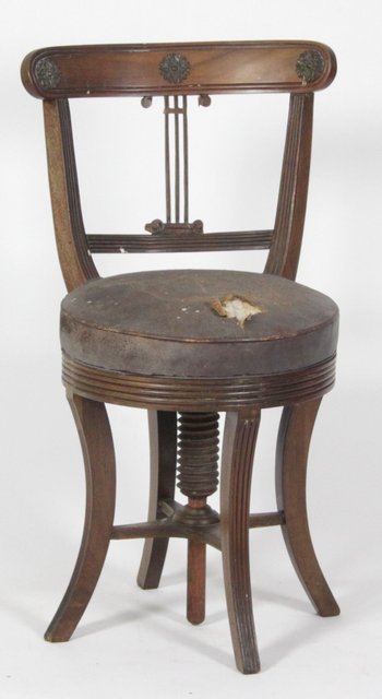 An Edwardian mahogany piano chair