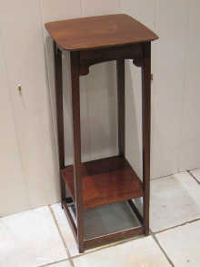 An Edwardian mahogany plant stand