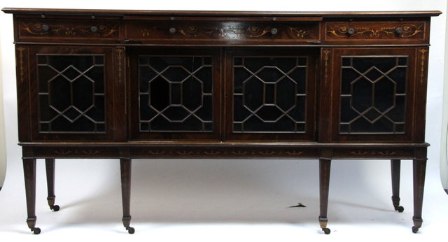 An Edwardian mahogany side