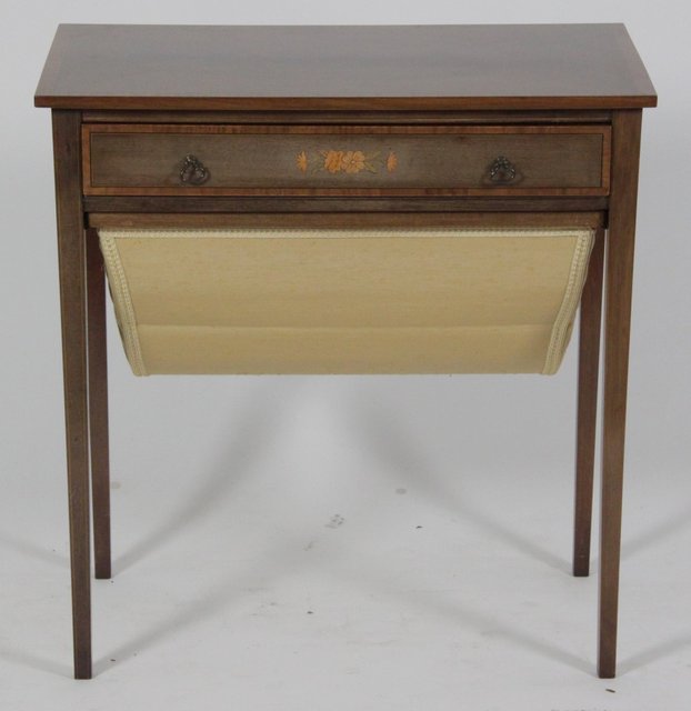 An Edwardian mahogany work table