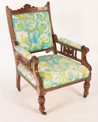 An Edwardian open armchair on
